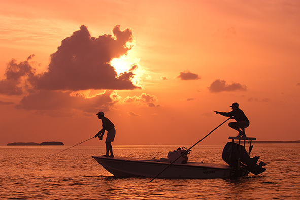 A Florida Keys guide points his angler to a bonefish off Islamorada. (Photo: Bob Krist/Florida Keys News Bureau)