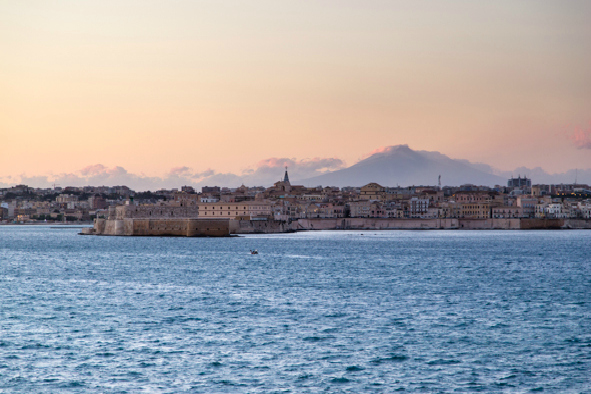 Mount Etna rising up behind Syracuse (Photo: Chris Allsop)