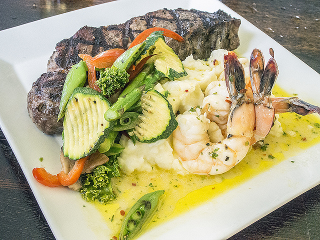 Rib eye steak and prawns at Saffron Salmon (Photo: Larry Miller via Flickr)