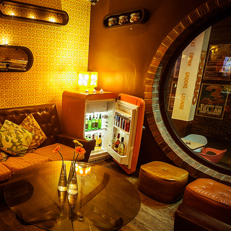 A raised seating area in the Orange Rooms (Photo: via Orange Rooms)