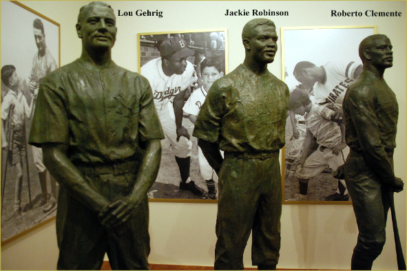 Bronze statues of Roberto Clemente, Lou Gehrig and Jackie Robinson honor the Hall of Famers, who overcame poverty and racial/cultural bias, for their exemplary "Character and Courage" both on and off the field. (Photo: Ron Cogswell via Flickr) 