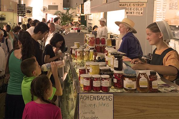 Shoppers stock up on honey, maple syrup, hot peppers and other canned goods from an Amish vendor inside Central Market, the nation's oldest farmers' market (Photo: Wendy Fontaine)