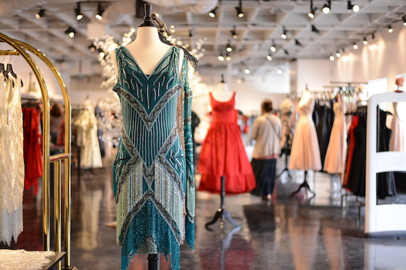 A chiffon flapper dress with sequins and fringe hangs inside Unique Vintage (Photo: Unique Vintage)