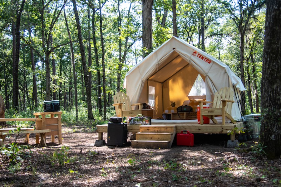 The Duck Blind is a platform-based canvas tent with memory foam mattresses for two or three guests