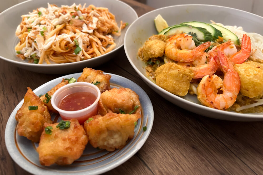 Fried dumplings and two noodle dishes at Native Noodles in New York City.