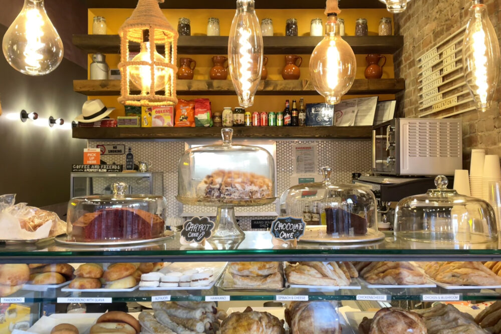 Cakes and pastries in a glass display case.