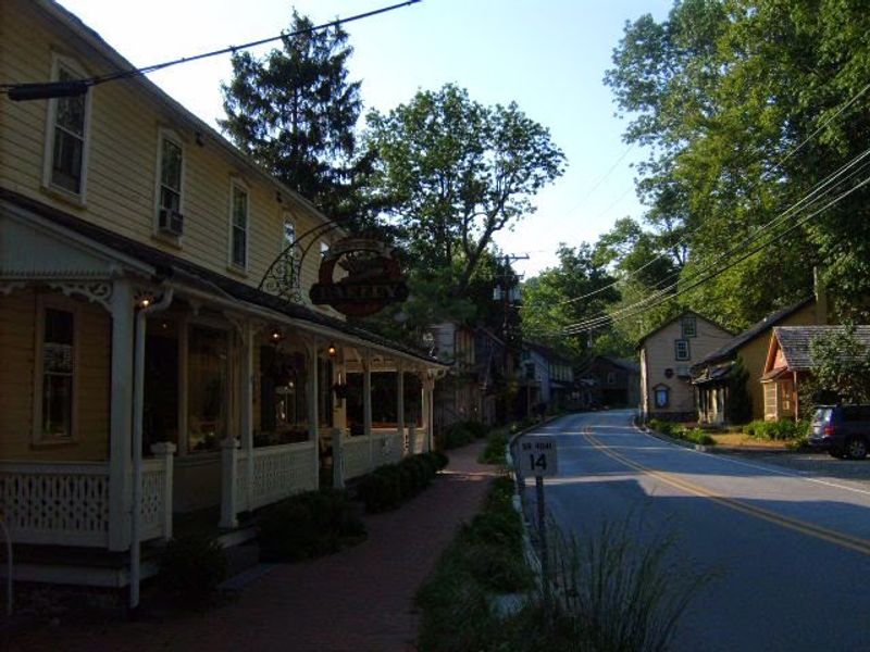 A Main Street with A Creek Running Beside It