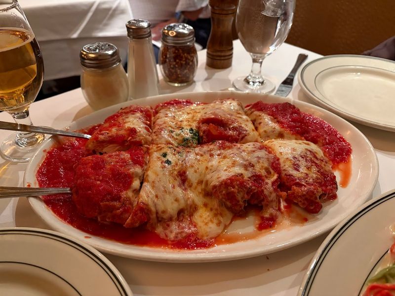 Veal Parmigiana That Covers The Whole Plate