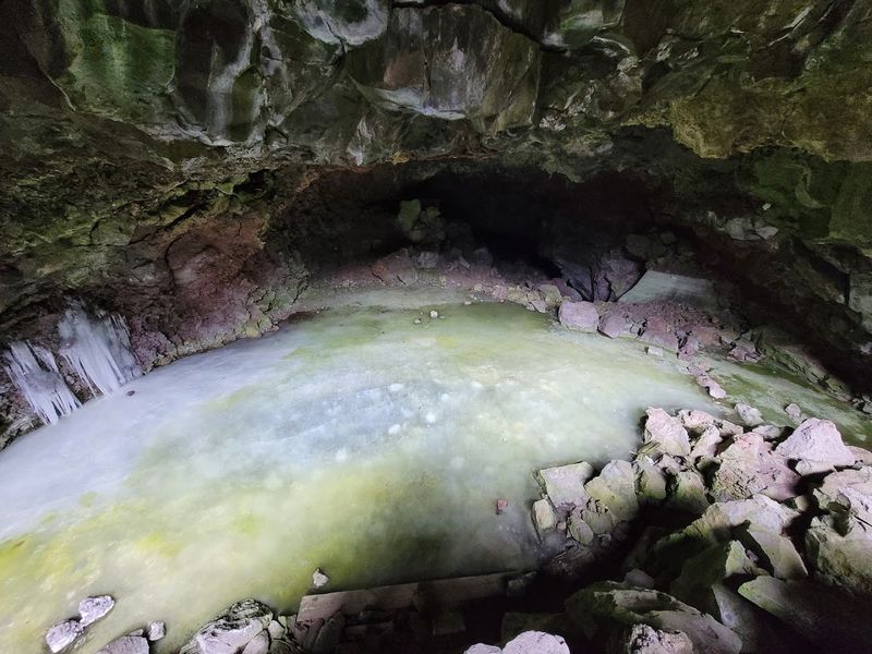 Blue-Green Ice Beneath Volcanic Rock