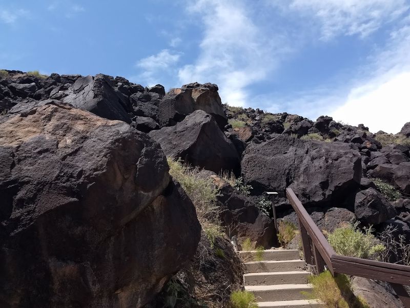 Desert Trails Framed By Rugged Rock