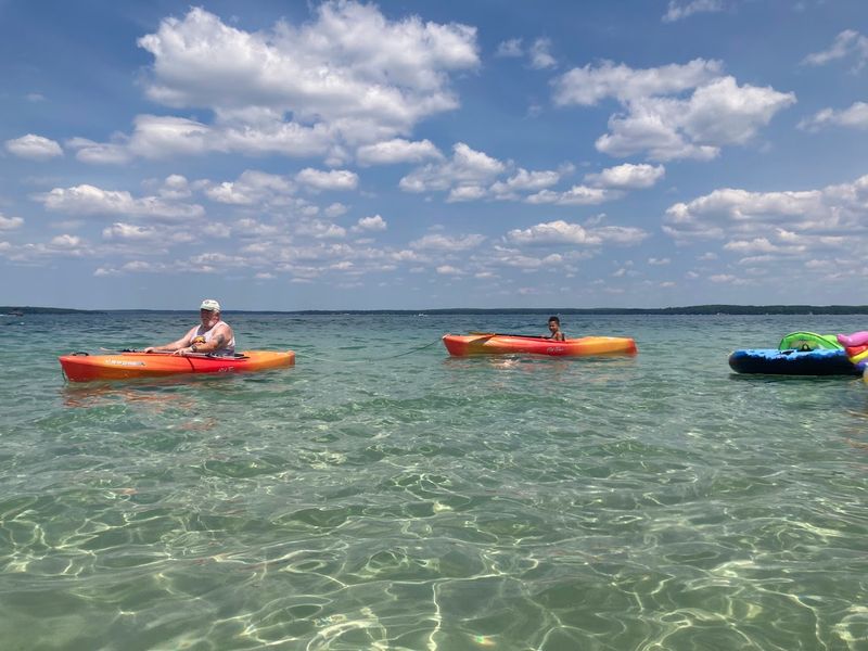 Paddleboarding And Kayaking On Glass-Like Water