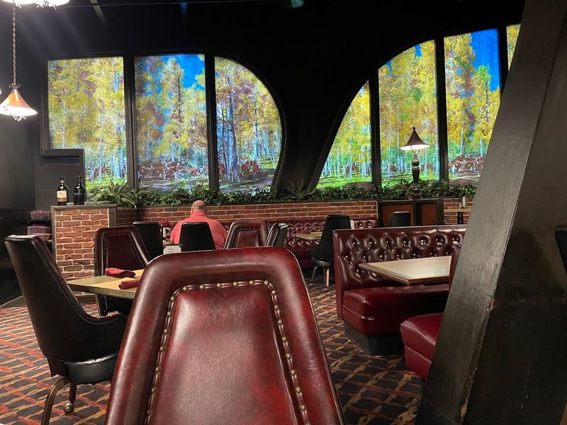 Red Leather Booths And Dark Wood That Refuse To Be Replaced