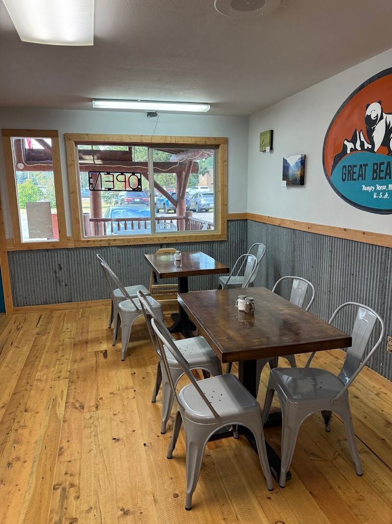 The Cozy Dining Room With Local Art On The Walls