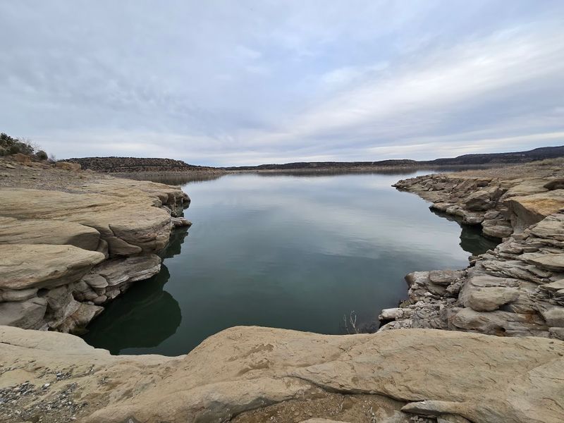Glassy Water And Desert Sky