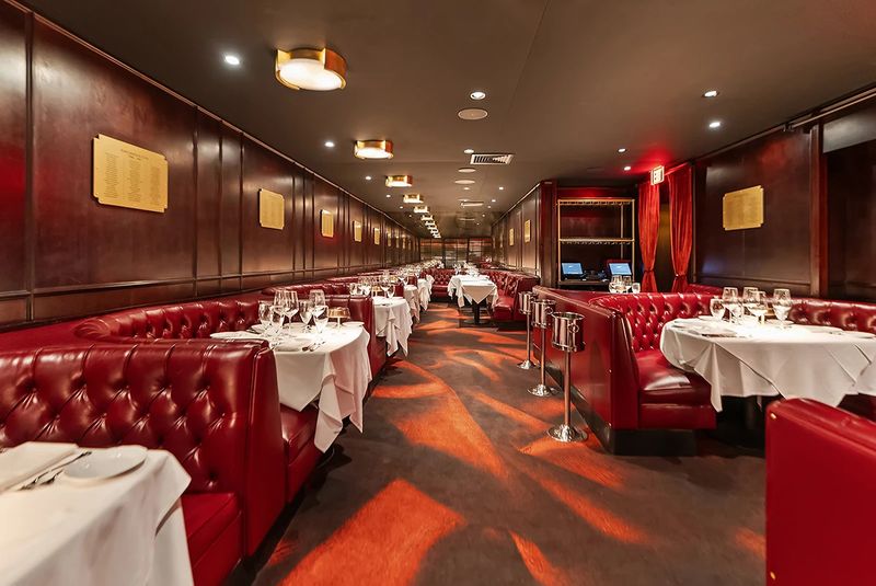 Red Leather Booths And A Room Frozen In Amber