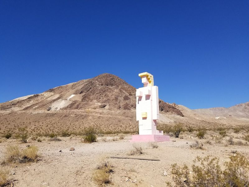 Sculptures Rising From Sand