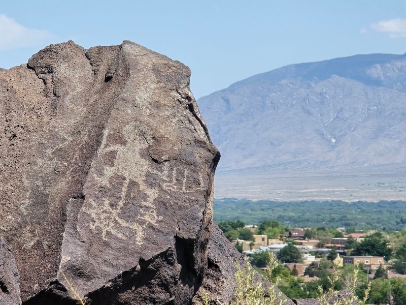Ancient Marks Across Black Volcanic Stone