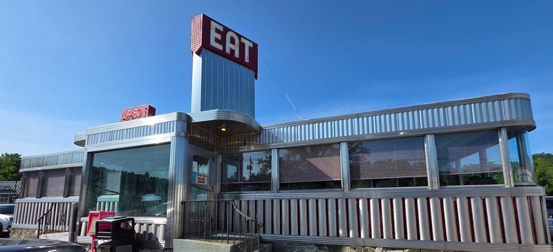 Why The Neon Sign And Stainless Steel Exterior Still Turn Heads