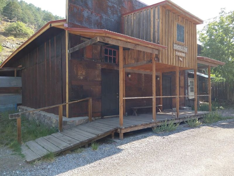 Wooden Porches Beneath Forested Canyon Walls