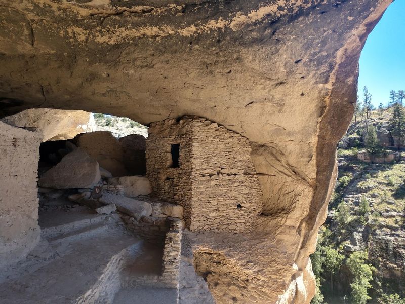 Sunlit Caves Above The Canyon Floor