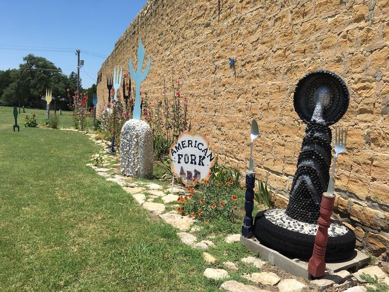 Sculptures Line The Street Outside The Building
