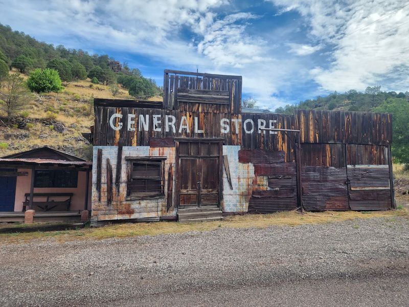 Weathered Storefronts And Dusty Canyon Views