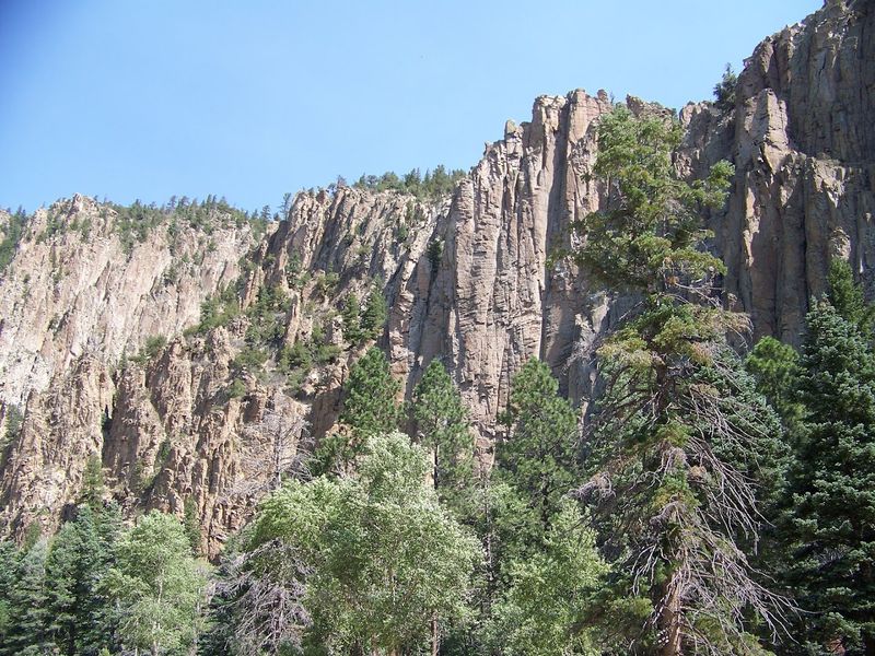 Towering Cliffs Above The Canyon Road