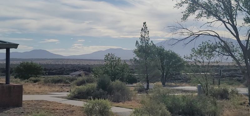 Jagged Basalt Framed By Distant Peaks