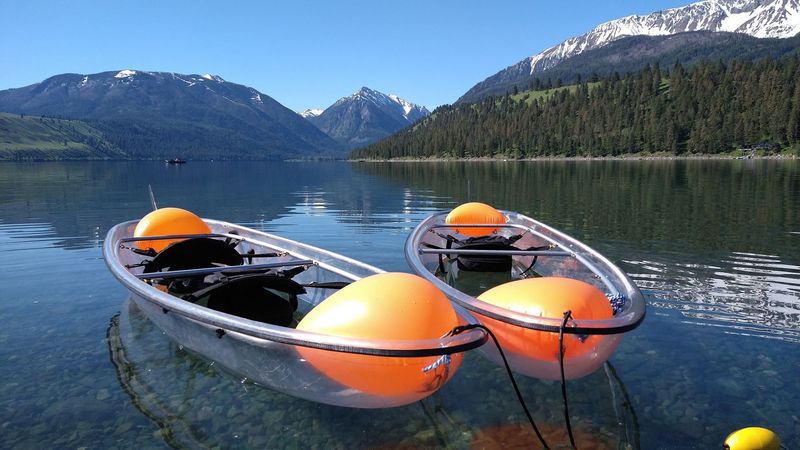 Kayaking And Paddleboarding On Glassy Water