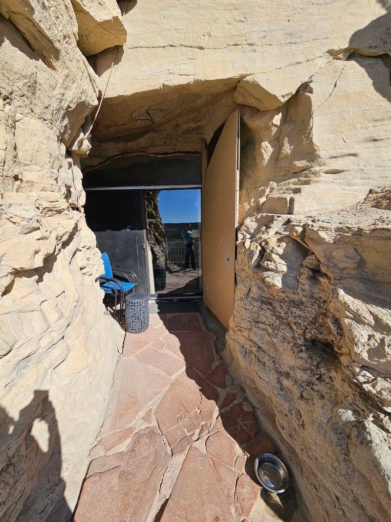 The Entrance Feels Hidden Inside The Sandstone