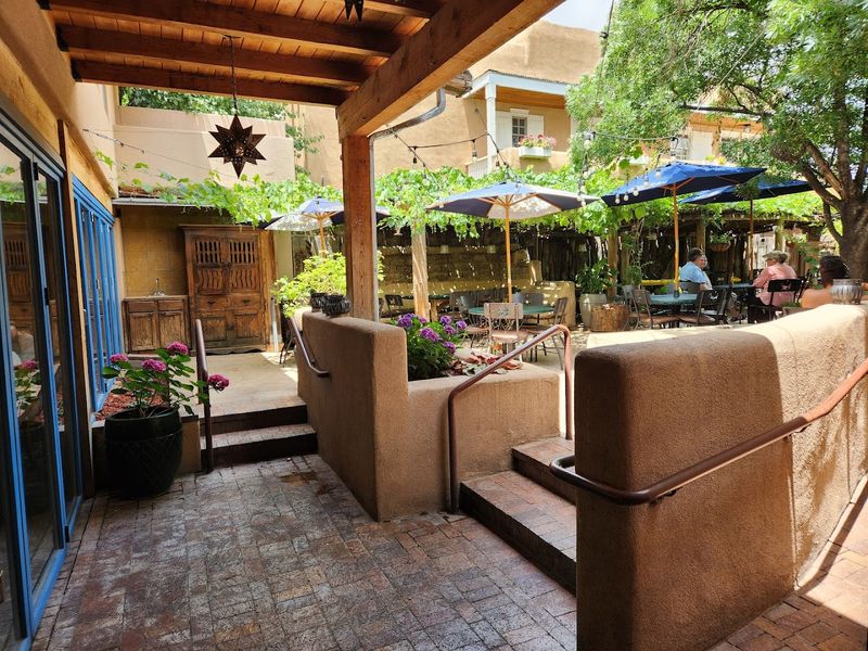 A Courtyard Beneath The Vines