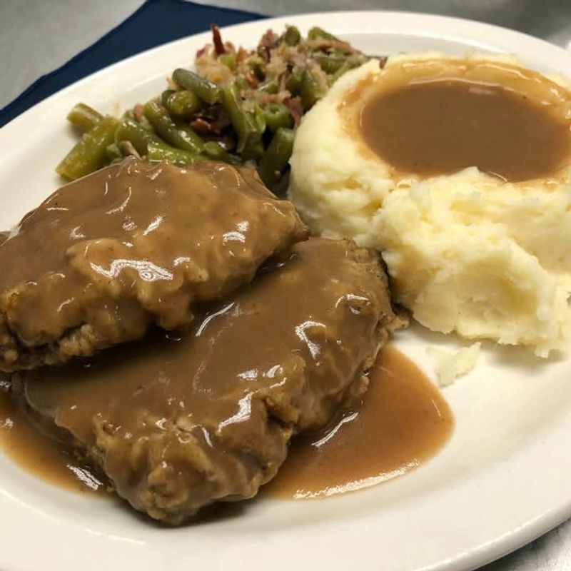 Mashed Potatoes Gravy And Rolls Complete The Plate
