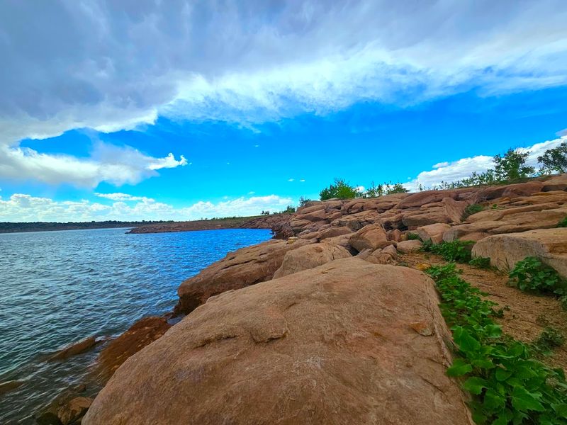 Where Desert Cliffs Drop Into Blue Water