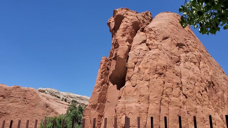 Towering Red Cliffs Dominate The Landscape