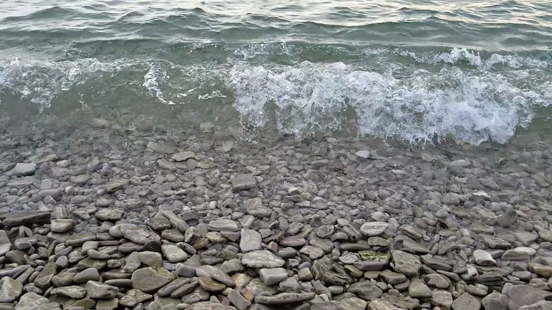 A Stone Beach Makes Water Shoes Look Brilliant