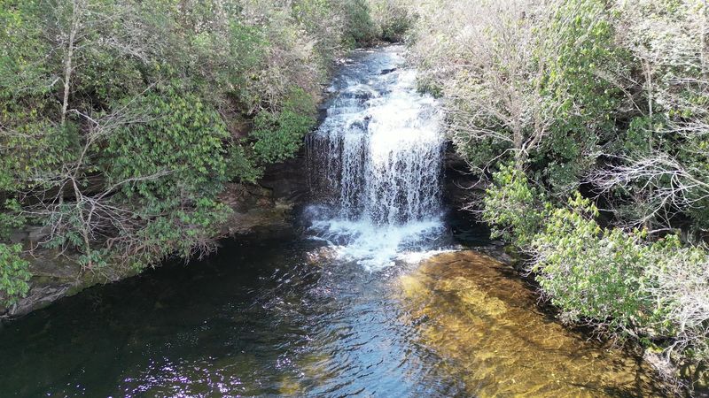 The Pool Sits Beneath A Roughly Twenty-Foot Cascade