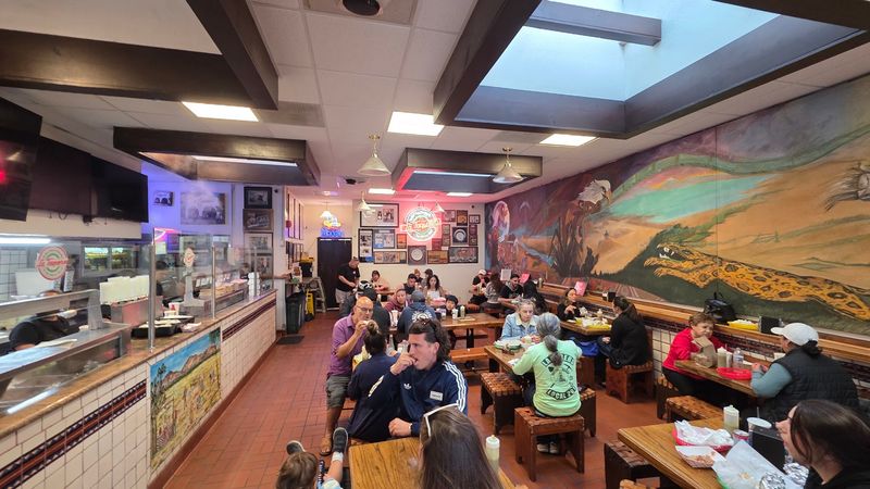 A Busy, Lively Room With Communal Tables