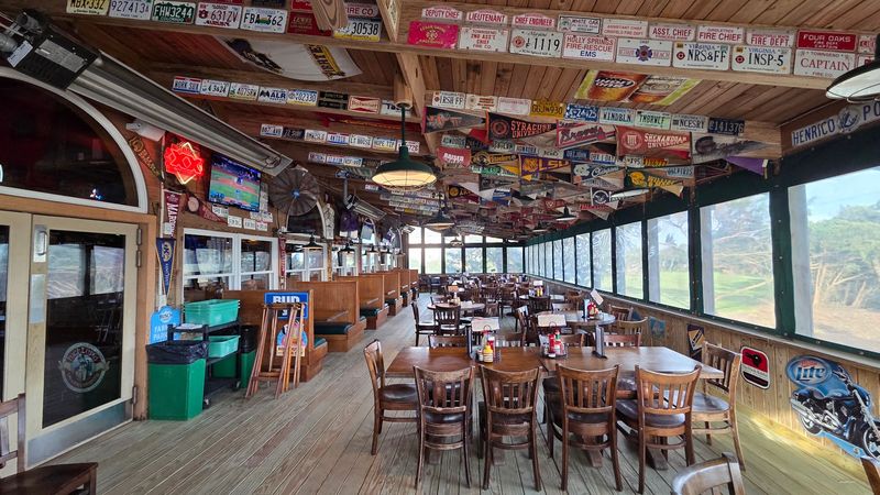 Walls Wrapped in License Plates and College Pennants