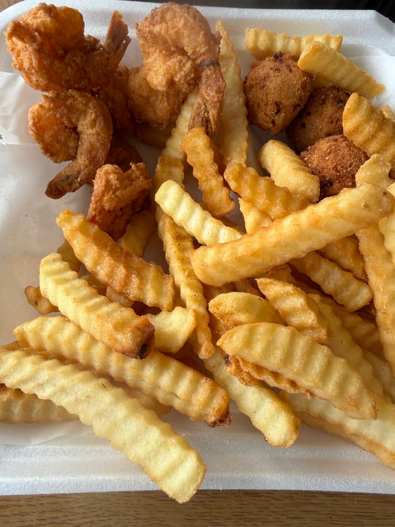 Hushpuppies And Fries Complete The Seafood Plate