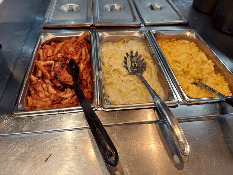 Pasta, Cheese, Bread, And Salad Keep The Plate Moving