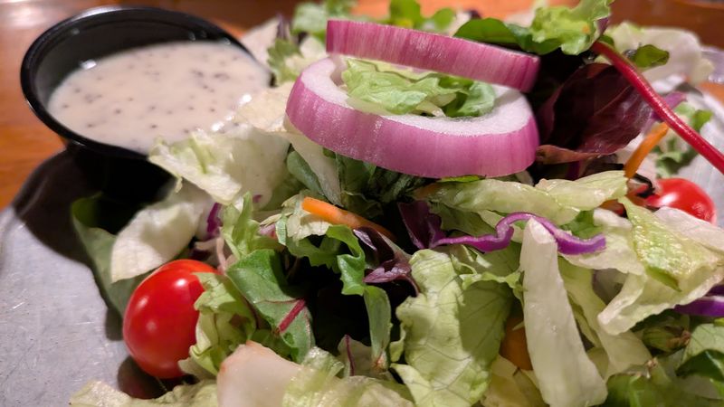 A Traditional Dinner Comes With Soup, Salad, Bread And A Side