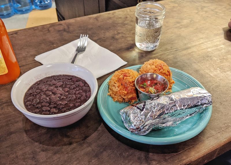 Beans, Rice, Curtido And Collard Greens Round Out The Meal