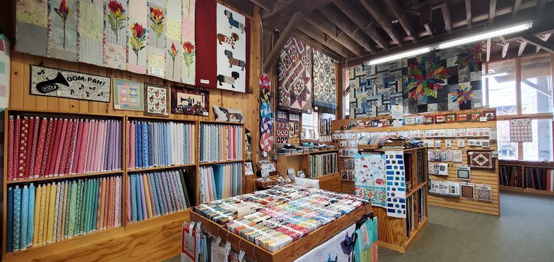 Handmade Quilts On Display Throughout The Shop