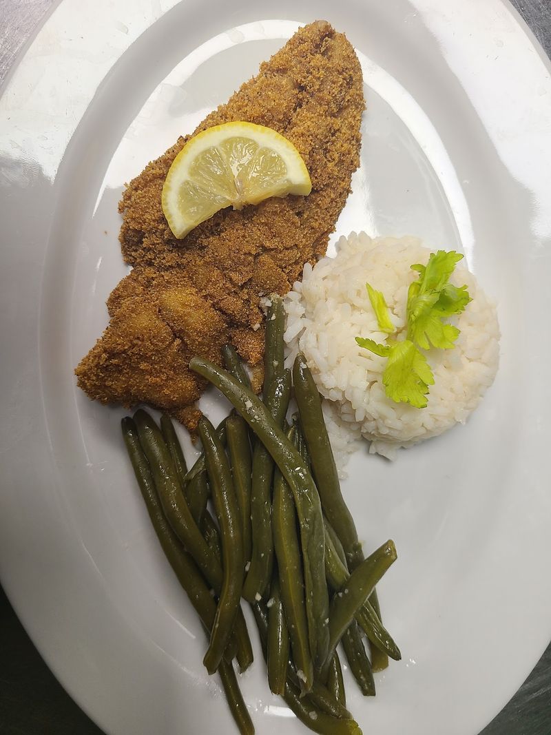 Smothered Chicken, Pork Chops, And Catfish Keep The Plates Familiar