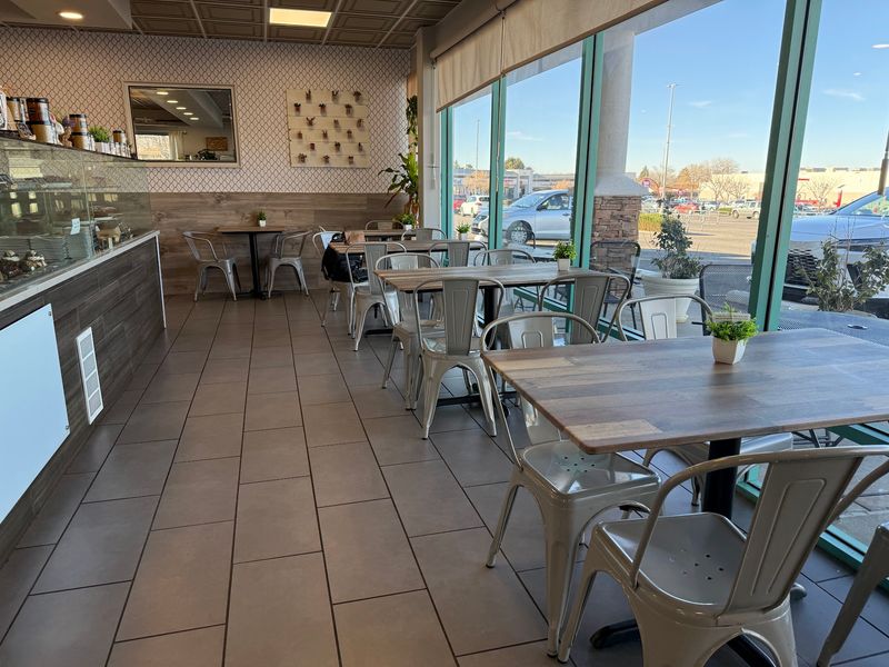 The Small Dining Area Feels Bright And Polished