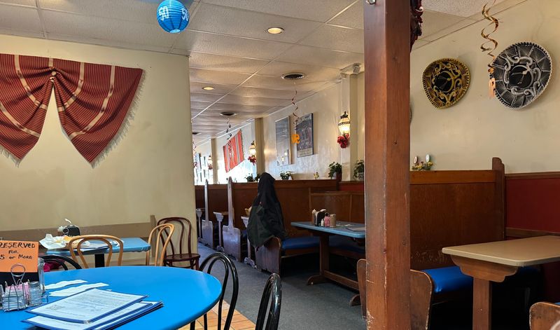 Turquoise Booths And A Bustling Diner Vibe