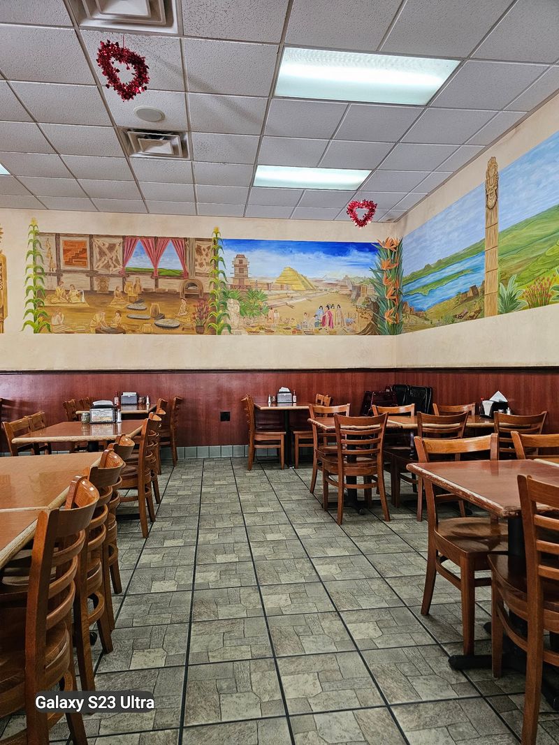 Murals, Wooden Tables, and a Covered Patio