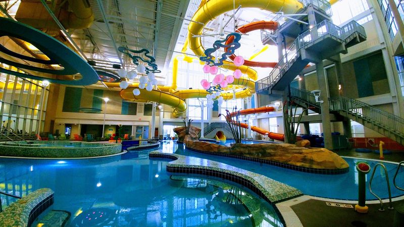 Colorful Lights Glow Above The Pools