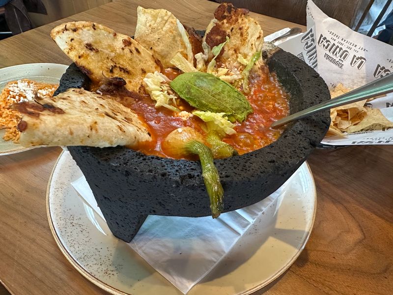 The Molcajete That Arrives Sizzling