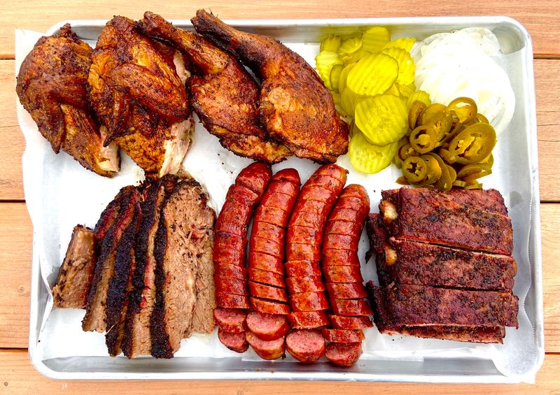 Brisket And Handmade Sausage Add More Smoke To The Tray